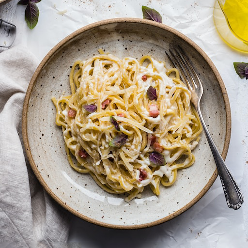 Carbonara topped with basil